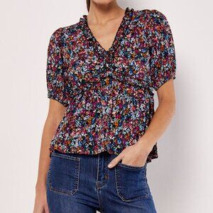 Top with ruffle detail and 1/2 sleeve